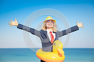 Successful young businesswoman on a beach