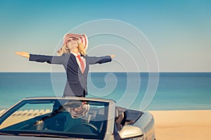 Successful young businesswoman on a beach