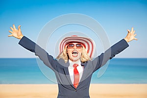 Successful young businesswoman on a beach