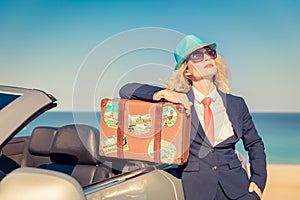 Successful young businesswoman on a beach