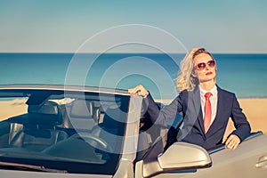 Successful young businesswoman on a beach