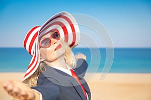 Successful young businesswoman on a beach