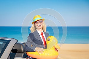 Successful young businesswoman on a beach