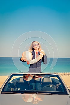 Successful young businesswoman on a beach