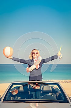 Successful young businesswoman on a beach