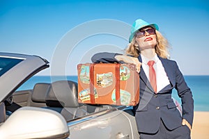 Successful young businesswoman on a beach