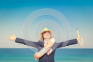 Successful young businesswoman on a beach