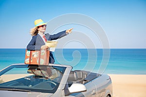 Successful young businesswoman on a beach