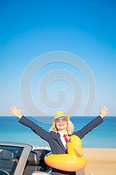 Successful young businesswoman on a beach