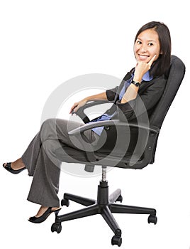 Successful young businesswoman on chair over white