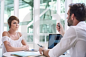 Successful young businesswoman getting financial advise from business consultant photo