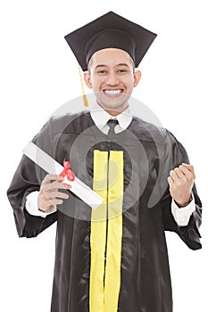 successful of young graduation man smiling while holding diploma