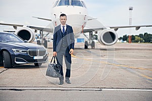 Successful young man going on a business flight