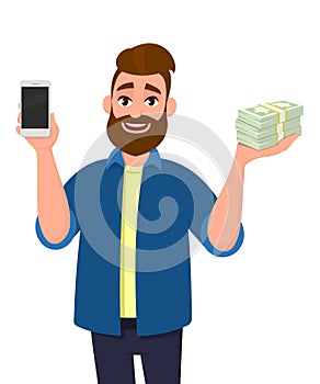 Successful young man showing or holding a mobile, cell, smart phone and bunch of cash, money, dollar, currency, bank notes in hand