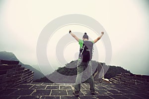 Woman hiker enjoy the view on top of great wall