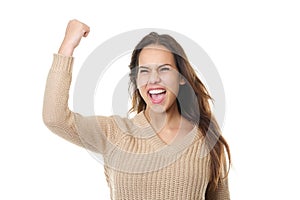 Successful young woman smiling and celebrating with fist pump
