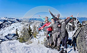 Successfull group of friends on mountain top.