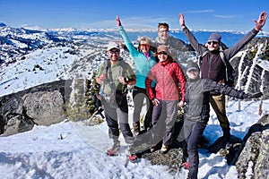 Successfull group of friends on mountain top.