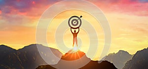 Successfully achieving your goal, Silhouette of businessman on mountain. Success Business Leadership, Winner on top. Concept of