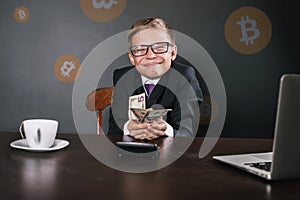 Successfully boy earning money with bitcoin cryptocurrency.