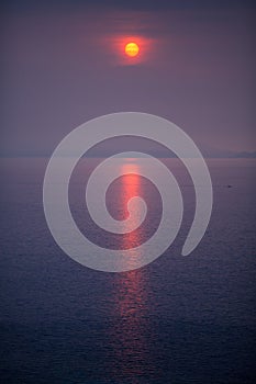 Red Sun over the sea photo