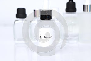 Succinic acid in a bottle, chemical ingredient in beauty product