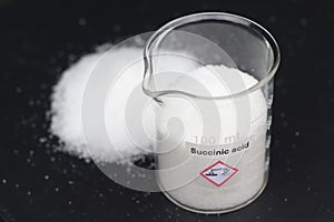 Succinic acid in glass, chemical in the laboratory