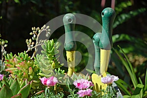 Succulent garden tools in decorative garden pot.