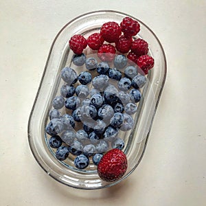 A succulent glass dish of berries - HEALTHY BREAKFAST SNACK