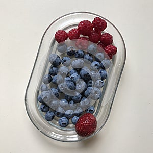 A succulent glass dish of berries - RAW VEGAN