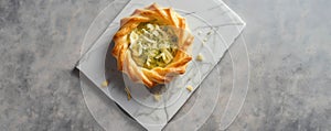 A succulent journey grated ParmigianoReggiano and es in a spiral of crunchy puff pastry.. AI generation photo