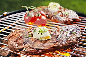 Succulent portion of rump steak grilling on BBQ