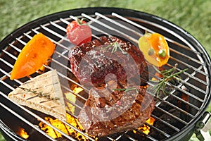 Succulent tender rump steak grilling on a barbecue