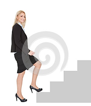 Sucessful businesswoman walking up a staircase