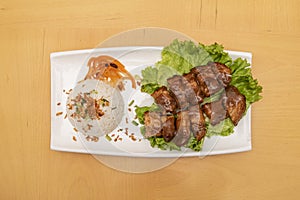 suckling pig kawali, a Filipino dish made from crispy fried pork belly garnished