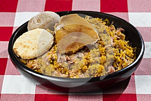 Typical tolimense lechona with rice - Typical Colombian dish photo