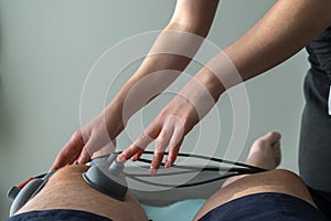 Suction cups applied to a knee in physiotherapy