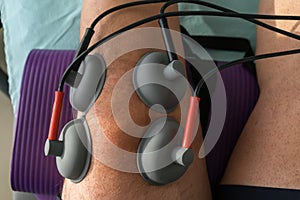 Suction cups applied to a knee in physiotherapy