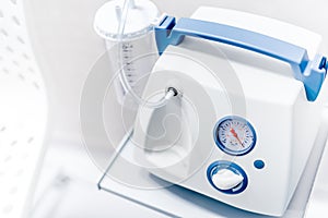 Suction Pump, surgical suction device in medical operating room photo