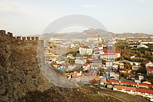 Sudak town and the part of the wall of the fortress in Crimea