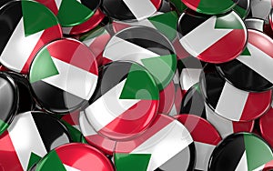Sudan Badges Background - Pile of Sudanese Flag Buttons.