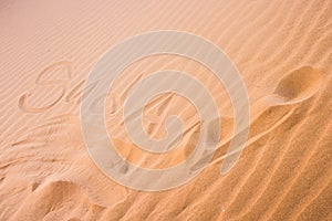 `Sudan` written in sand.