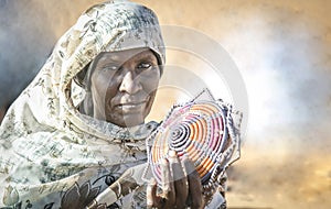 Sudanese woman selling souvenirs in a desert