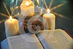 Sudent Studying Bible at Christmas By Candlelight