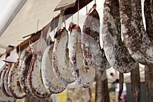 Sudzhuk or sudjuk. Flat dry salami or sausages. Gourmet meat. Delicacy salami. Flat dry sausage. jerky