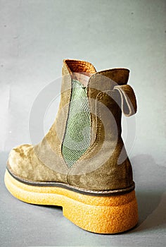 the sued boots with a side zip at each side and rubber soles are shown