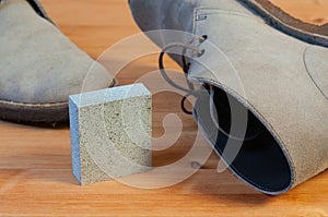 A suede eraser and a pair of suede boots