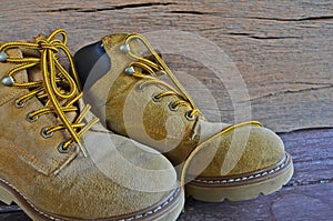 Suede shoes on wood background