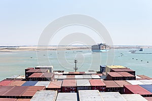 Suez Canal - view on the containers loaded on deck of cargo ship