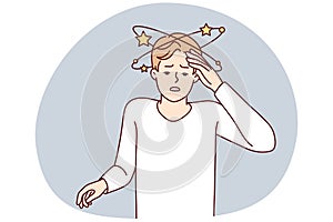 Suffering man experiencing pain in head after severe injury puts hand on forehead. Vector image